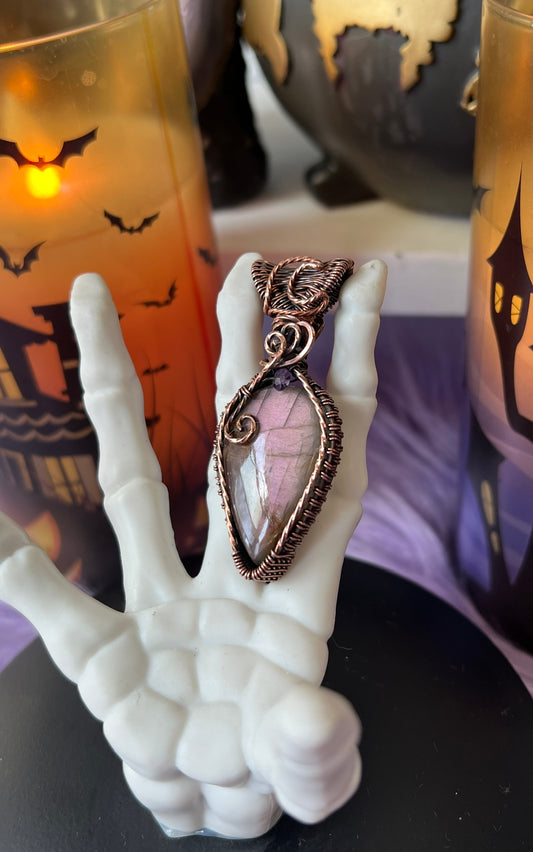 Handmade mauve purple flash Labradorite pendant in potion bottle design with copper wire wrapping and moon detail – witchy necklace
