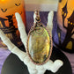 Handmade Labradorite pendant with golden green flash and hammered copper moon detail – witchy necklace