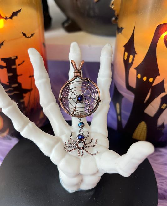 Handmade copper spiderweb pendant with dangling spider and chrome blue purple glass beads – witchy Halloween necklace
