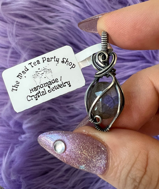 Deep blue flash labradorite pendant wrapped in oxidized silver,