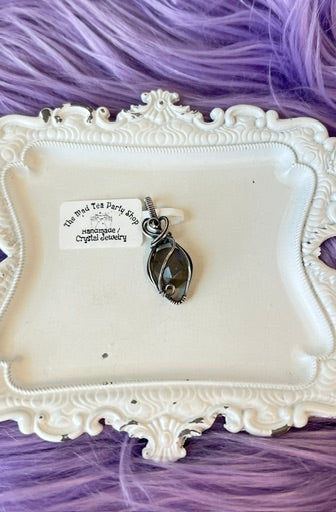 Deep blue flash labradorite pendant wrapped in oxidized silver,