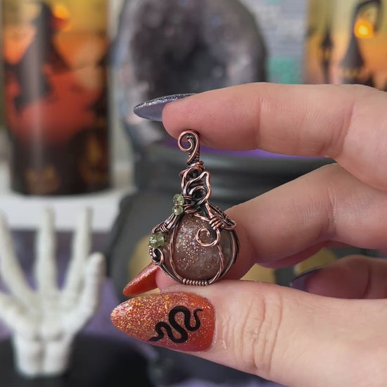 Handmade Sunstone pumpkin pendant with Peridot bead accents wrapped in copper wire – witchy Halloween necklace
