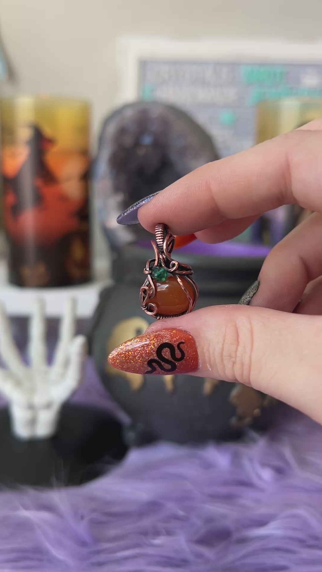 Handmade Carnelian pumpkin pendant with green crystal bead accent wrapped in copper – witchy Halloween necklace
