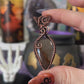 Handmade mauve purple flash Labradorite pendant in potion bottle design with copper wire wrapping and moon detail – witchy necklace
