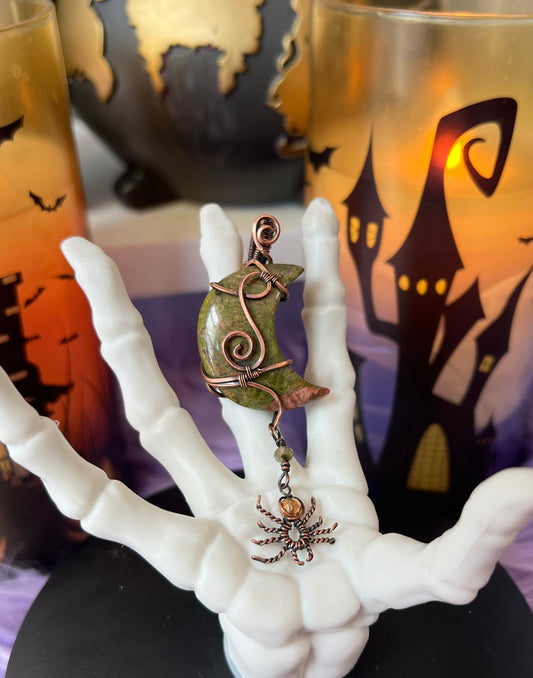 Handmade Unakite crescent moon pendant wrapped in copper with dangling spider featuring orange aura crystal bead – witchy Halloween necklace
