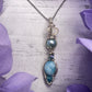 Handmade silver Larimar and blue pearl pendant with swirl wire design and ocean-inspired accents